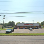 Dollar Tree store with parking lot, cars, and street view.